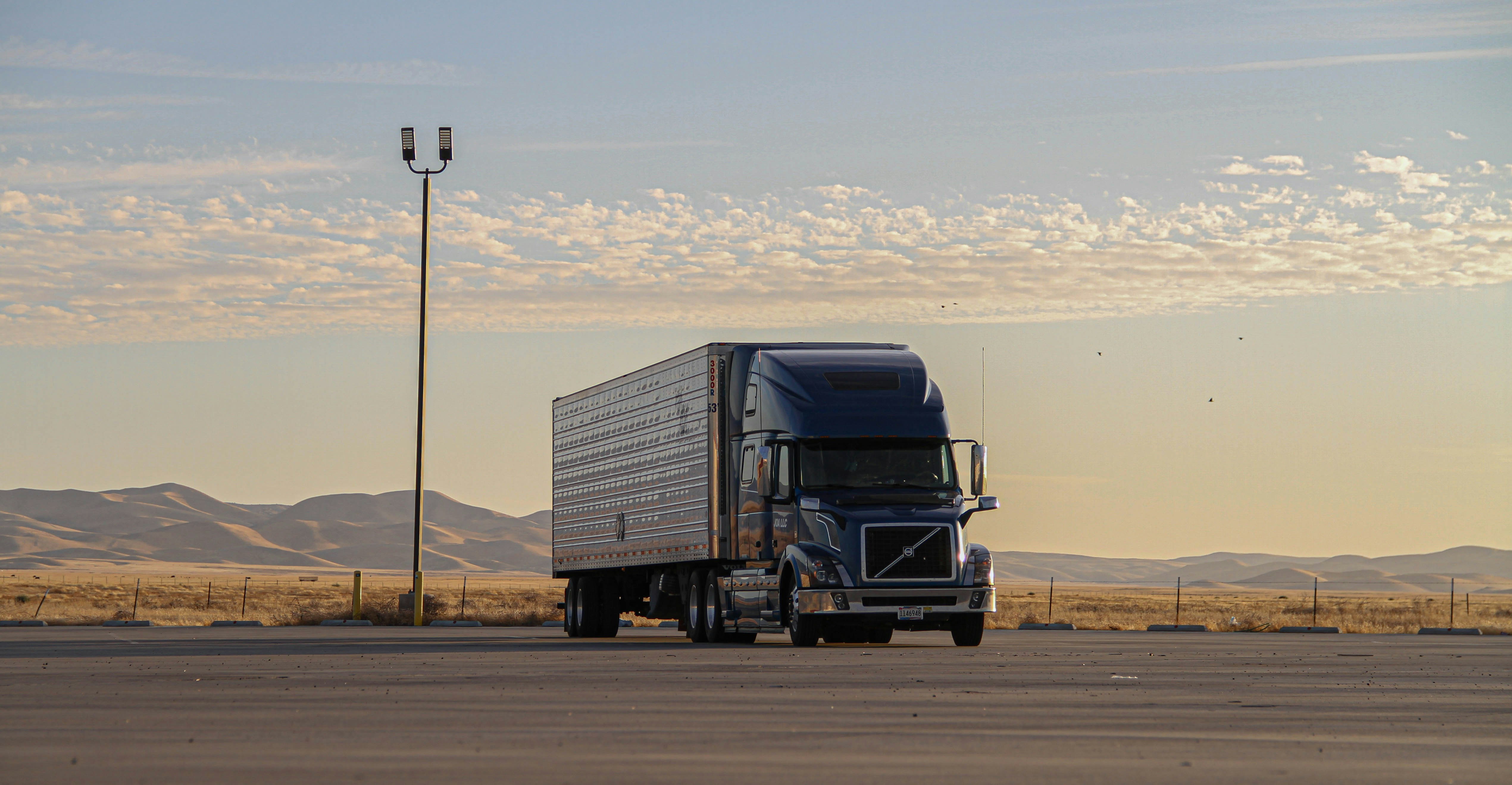 A long-haul truck parked at golden hour.